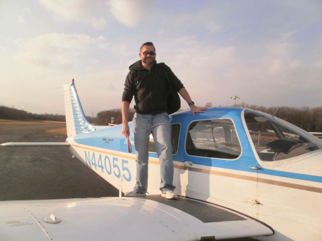 Justin Ramirez with a Piper Cherokee on the ramp